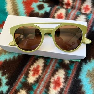 Goodr sunglasses Fossil finding focals in green.